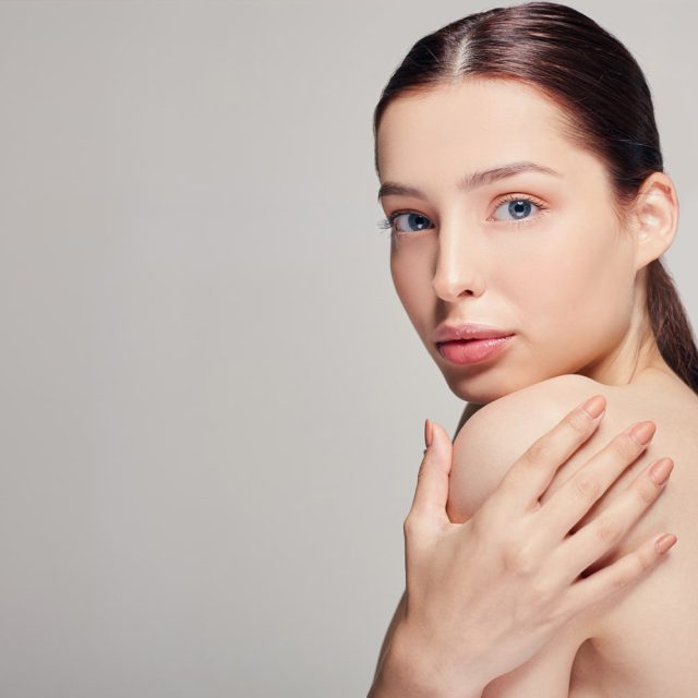 young-beautiful-woman-with-blue-eyes-full-lips-holds-hand-his-shoulder